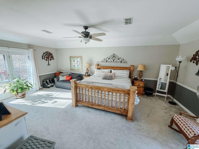 carpeted bedroom featuring visible vents, ceiling fan, and baseboards