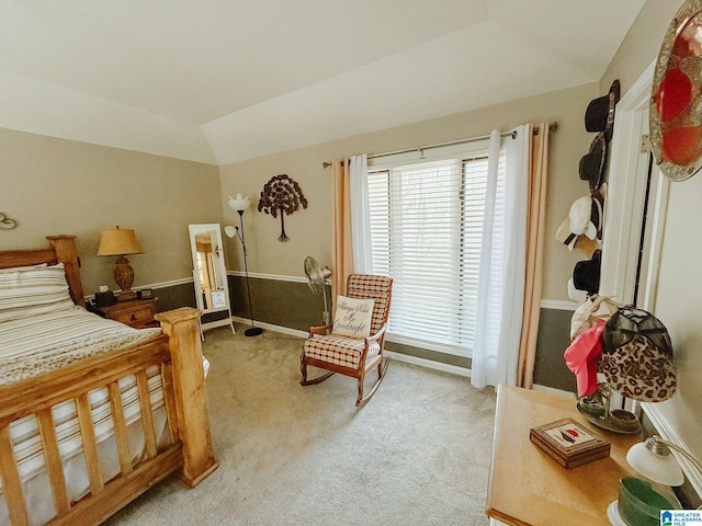 bedroom featuring lofted ceiling and light colored carpet