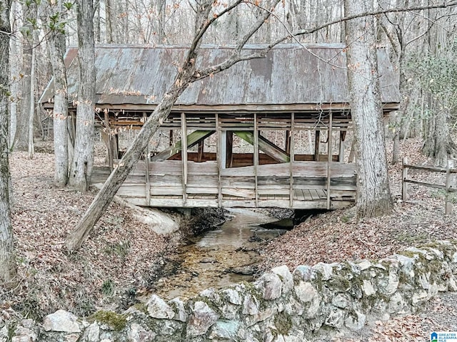 exterior space featuring a barn and an outbuilding