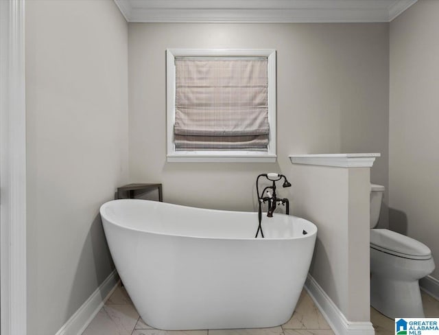 full bath featuring marble finish floor, a soaking tub, and baseboards