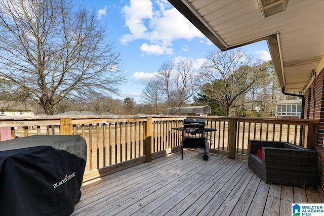 wooden deck featuring grilling area