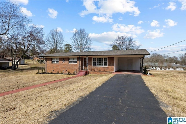 ranch-style home with driveway, crawl space, a front lawn, a carport, and brick siding