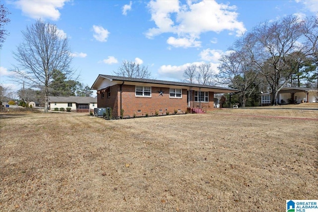 ranch-style home featuring crawl space, a front lawn, and brick siding