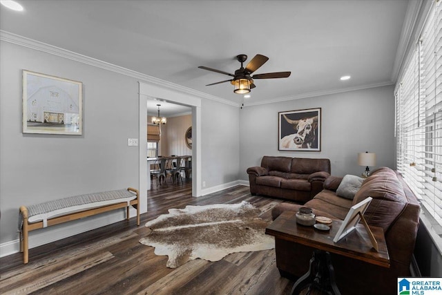 living room featuring ornamental molding, a wealth of natural light, baseboards, and wood finished floors