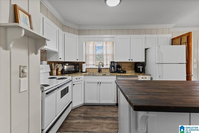 kitchen featuring white appliances, white cabinetry, ornamental molding, and a sink