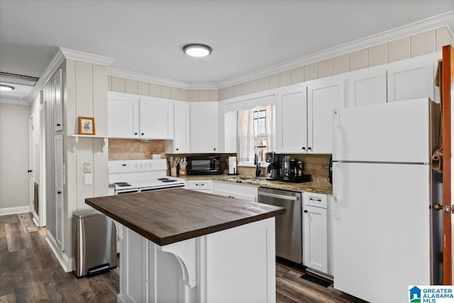 kitchen featuring white appliances, a kitchen island, wood counters, ornamental molding, and white cabinetry