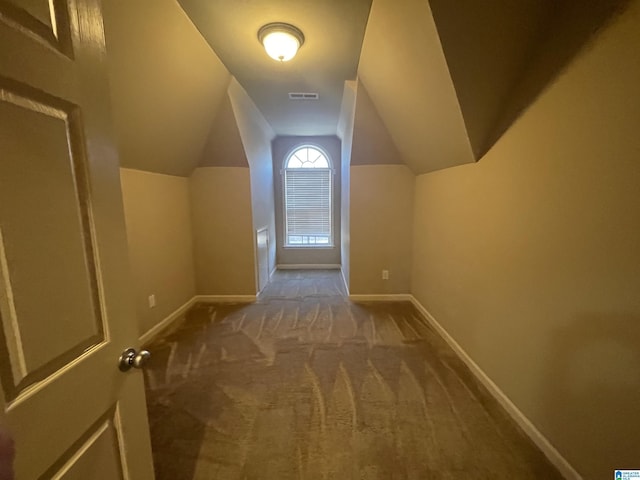 bonus room featuring visible vents, baseboards, lofted ceiling, and carpet flooring