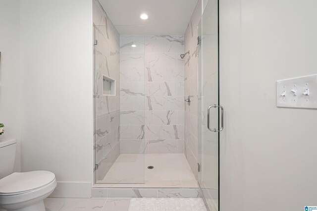 bathroom with marble finish floor, recessed lighting, toilet, a stall shower, and baseboards