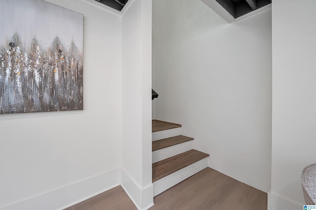 stairway with wood finished floors