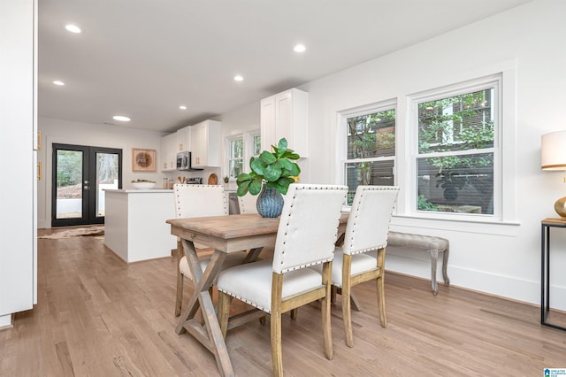 dining space featuring recessed lighting, french doors, baseboards, and light wood finished floors