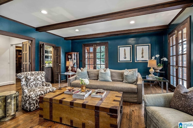 living room featuring baseboards, wood finished floors, french doors, beam ceiling, and recessed lighting