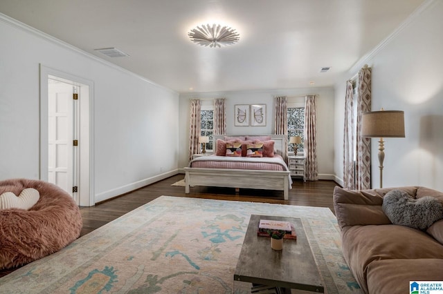 bedroom featuring dark wood-style floors, baseboards, visible vents, and crown molding