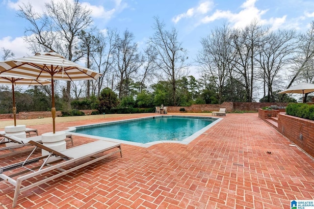 pool with a patio area