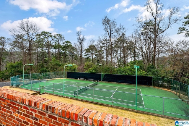 view of sport court with fence