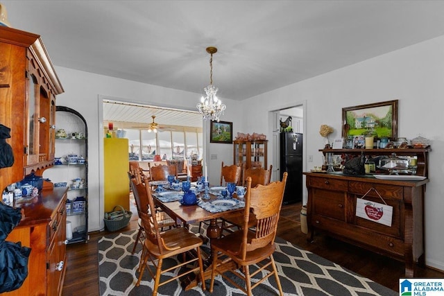 dining area featuring a chandelier and wood finished floors