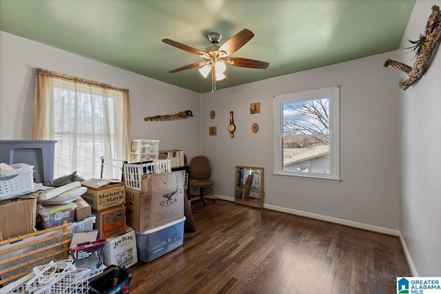 interior space with ceiling fan, baseboards, and wood finished floors