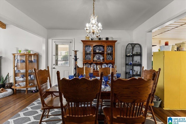 dining room featuring a chandelier and wood finished floors