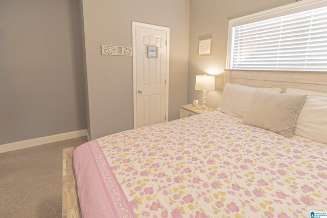 bedroom featuring carpet floors and baseboards