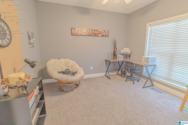 office with carpet floors, baseboards, visible vents, and a ceiling fan