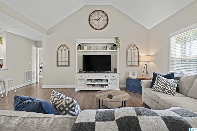 living area featuring visible vents, lofted ceiling, baseboards, and dark wood-style floors