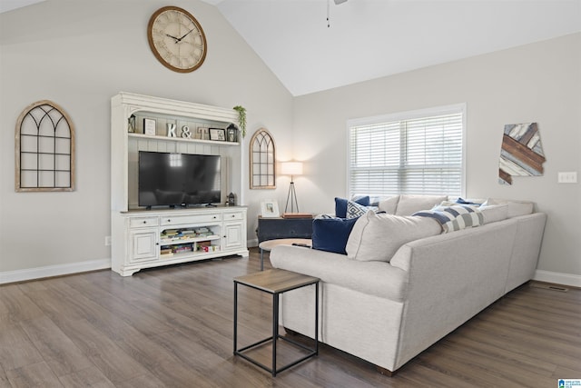 living room featuring a ceiling fan, baseboards, dark wood-style flooring, and high vaulted ceiling