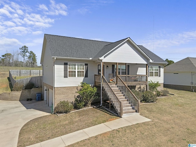 ranch-style home featuring brick siding, an attached garage, stairway, covered porch, and driveway