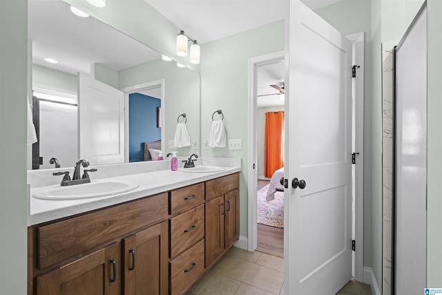 full bath with a sink, ensuite bath, and tile patterned floors