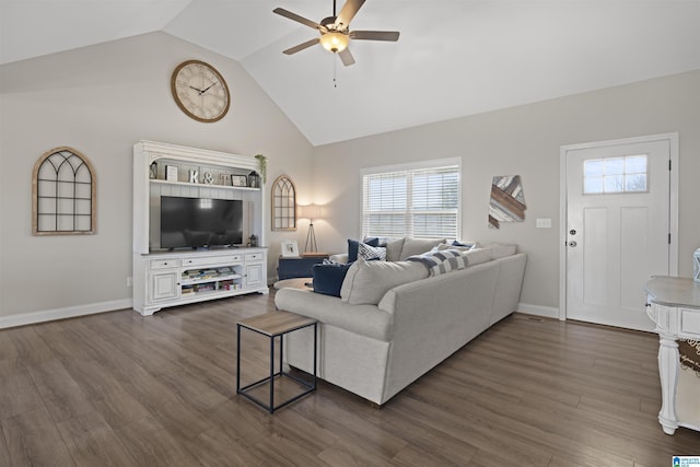 living area featuring baseboards, ceiling fan, dark wood-style flooring, and vaulted ceiling