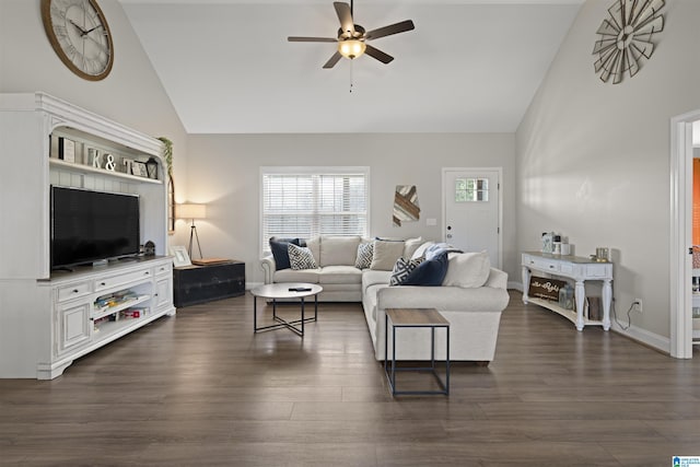 living area featuring baseboards, high vaulted ceiling, ceiling fan, and dark wood-style flooring