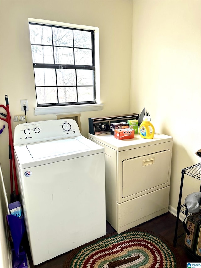 laundry room featuring washer and dryer, laundry area, and dark wood-style flooring