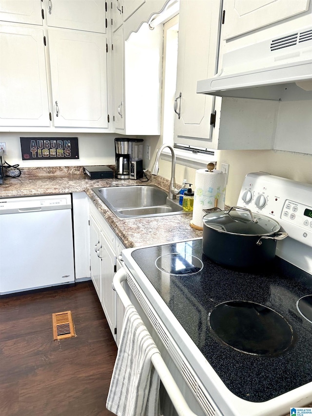 kitchen featuring electric range, visible vents, dishwasher, under cabinet range hood, and a sink