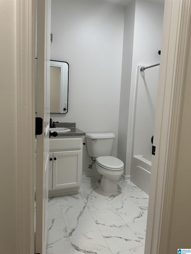 full bathroom with toilet, marble finish floor, shower / bathing tub combination, and vanity