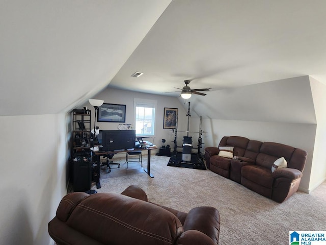 carpeted living room featuring visible vents, vaulted ceiling, and ceiling fan