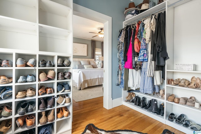 spacious closet with ceiling fan and wood finished floors