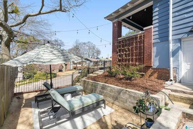 view of patio / terrace with fence