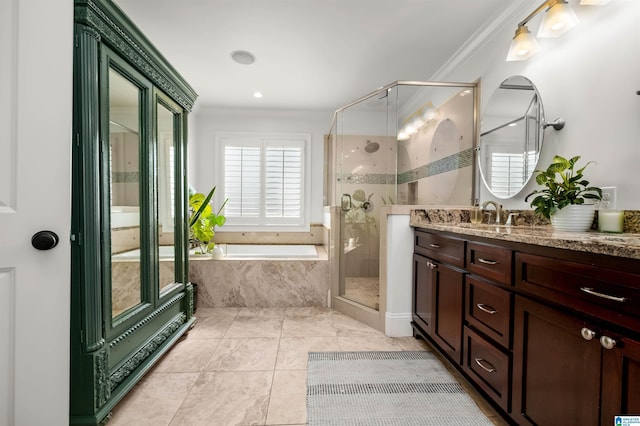 full bathroom featuring tile patterned flooring, ornamental molding, a stall shower, a bath, and vanity