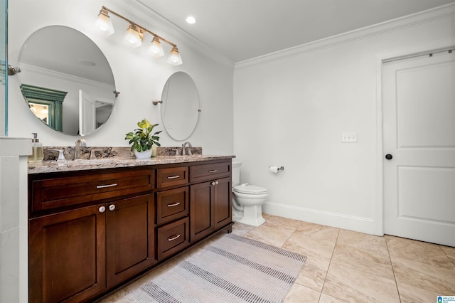 bathroom featuring a sink, double vanity, and crown molding