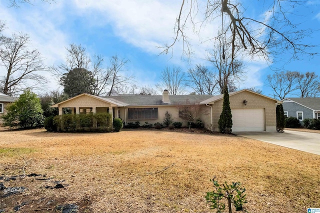 single story home featuring concrete driveway, a garage, and a chimney