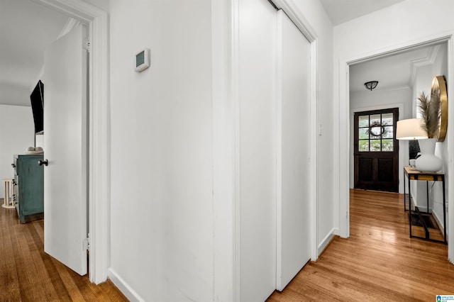 corridor with light wood-style flooring