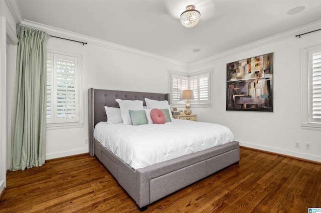 bedroom with wood finished floors, baseboards, and ornamental molding