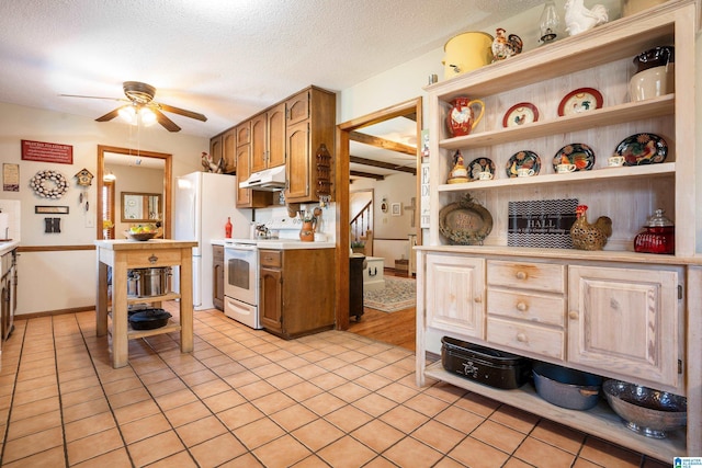 kitchen with open shelves, light countertops, ceiling fan, white appliances, and under cabinet range hood