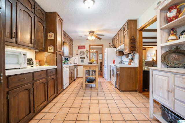 kitchen with open shelves, ceiling fan, a textured ceiling, white appliances, and under cabinet range hood