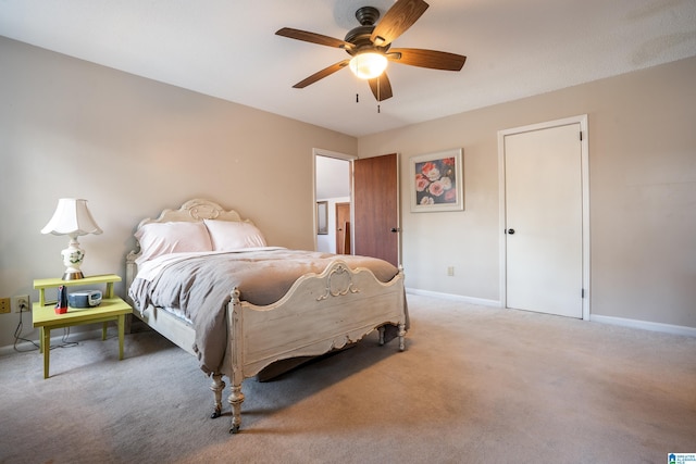 bedroom featuring a ceiling fan, carpet, and baseboards