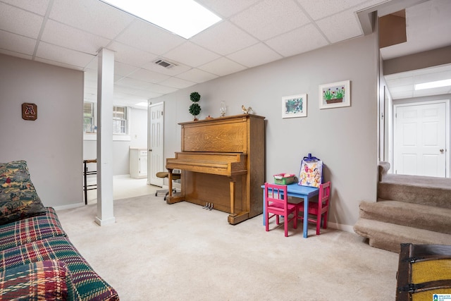 interior space with carpet, visible vents, a paneled ceiling, and stairway