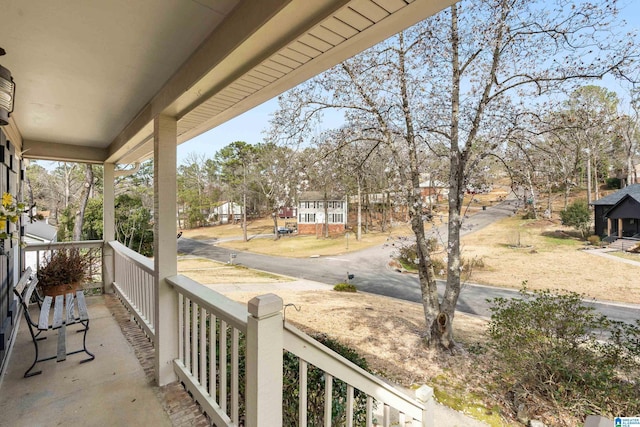 balcony with covered porch and a residential view