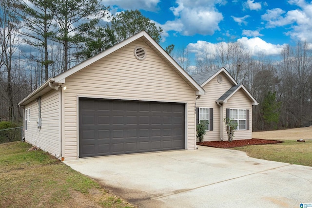 ranch-style house with a garage, a front yard, and fence