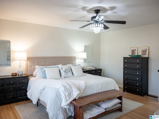 bedroom featuring light wood-type flooring and a ceiling fan