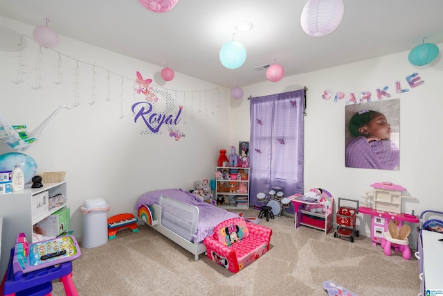 bedroom with visible vents and carpet floors