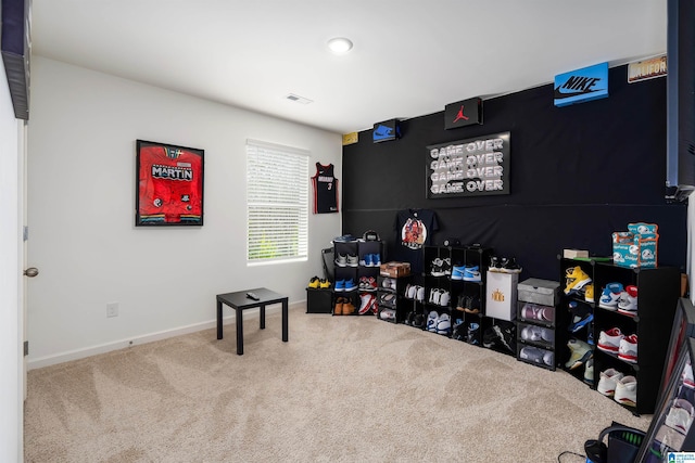 rec room with visible vents, carpet floors, and baseboards