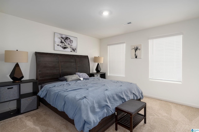 bedroom featuring carpet, visible vents, and baseboards